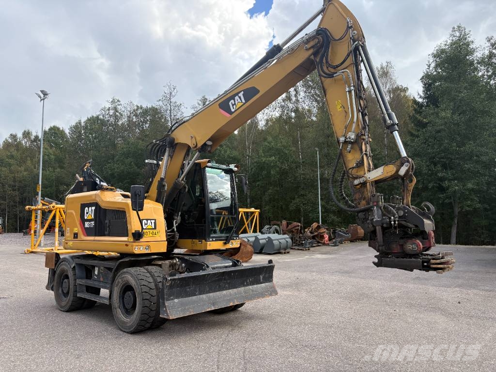 CAT M 317 حفارات بعجل