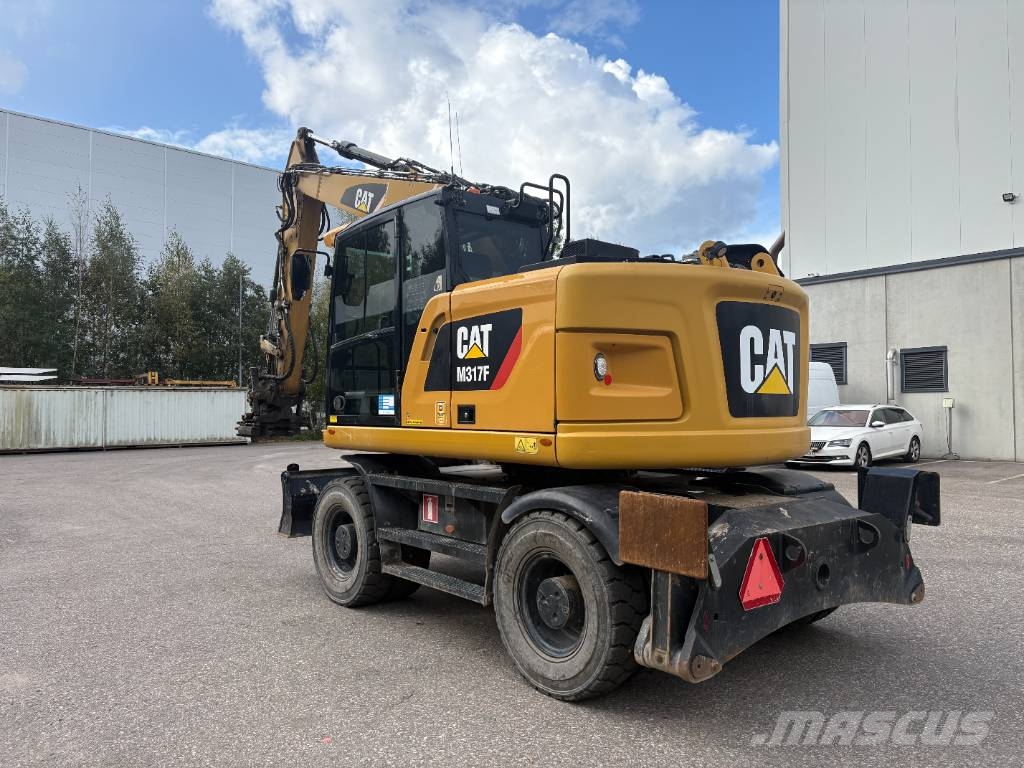 CAT M 317 حفارات بعجل