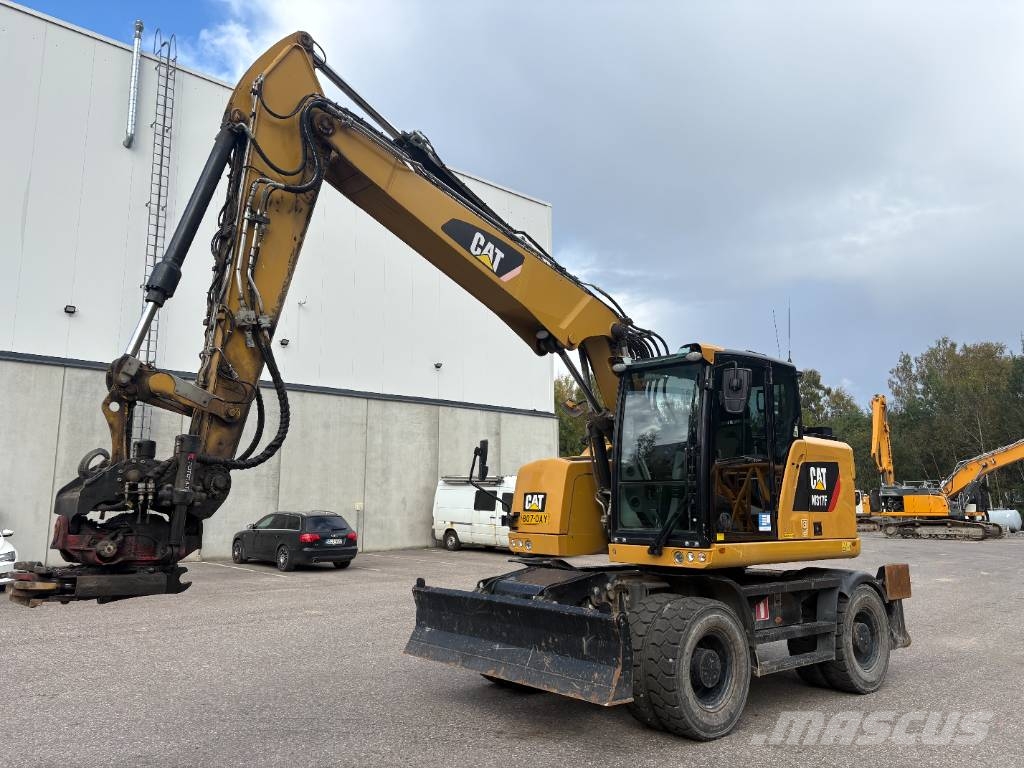 CAT M 317 حفارات بعجل