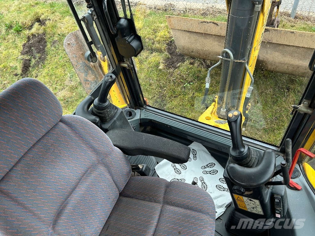 New Holland LB 115 B-4 PS Екскаватори-навантажувачі