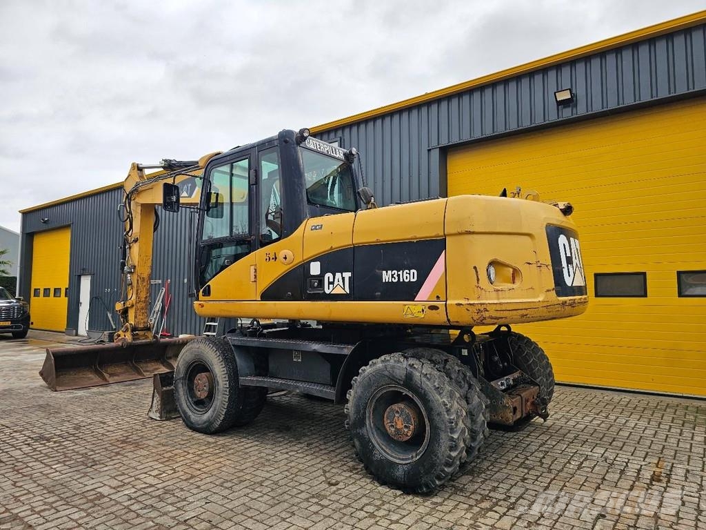 CAT M316D Ekskavatori uz riteņiem