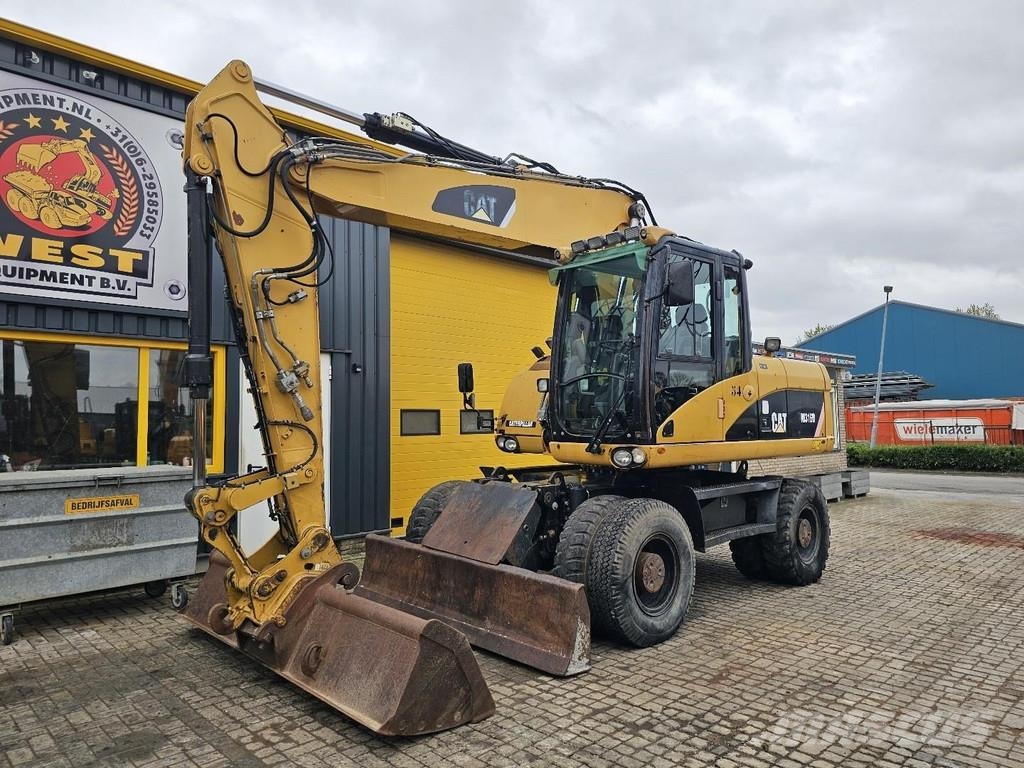 CAT M316D Ekskavatori uz riteņiem