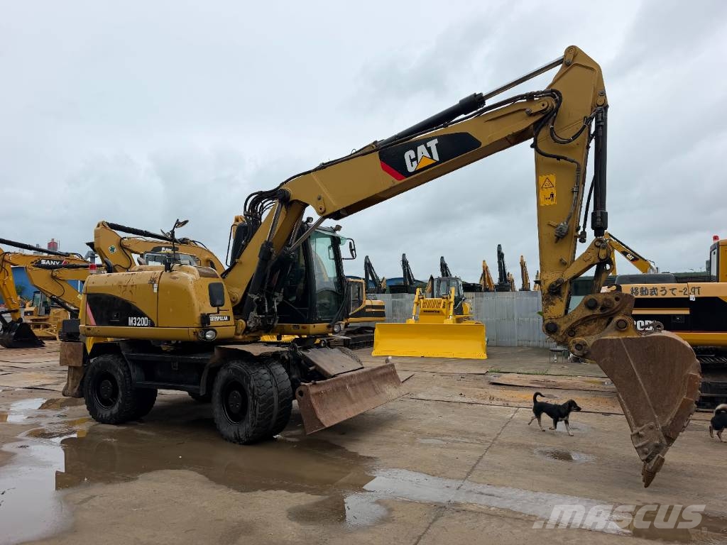 CAT M320D Bagri na kolesih