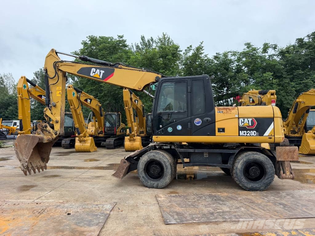 CAT M320D Bagri na kolesih