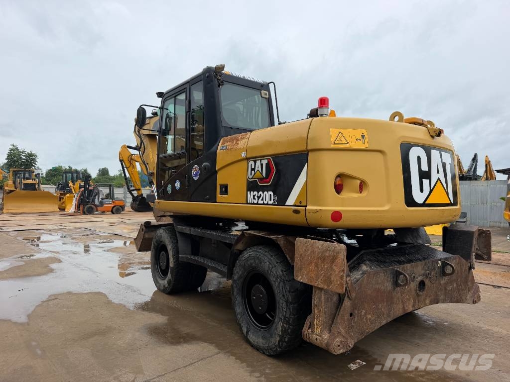 CAT M320D Bagri na kolesih