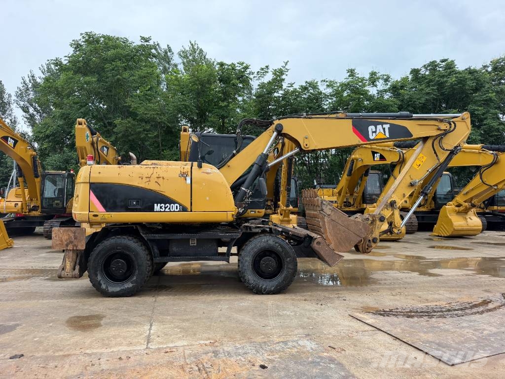 CAT M320D Bagri na kolesih