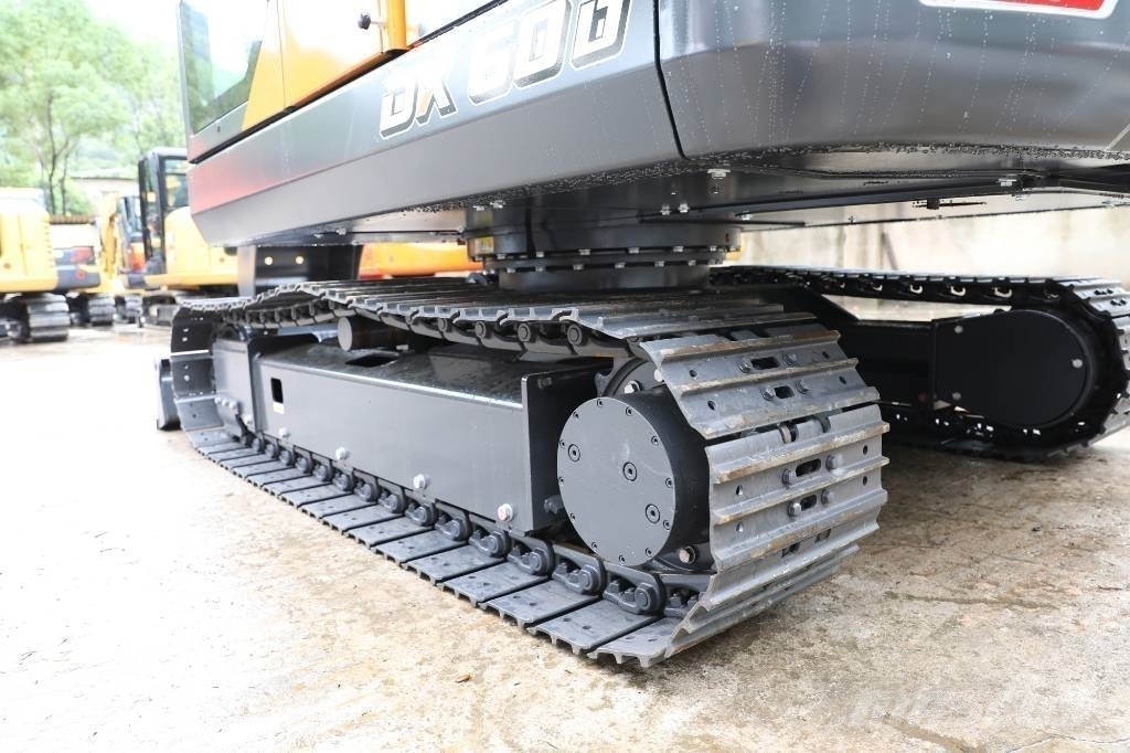Develon DX 60 D Wielgraafmachines