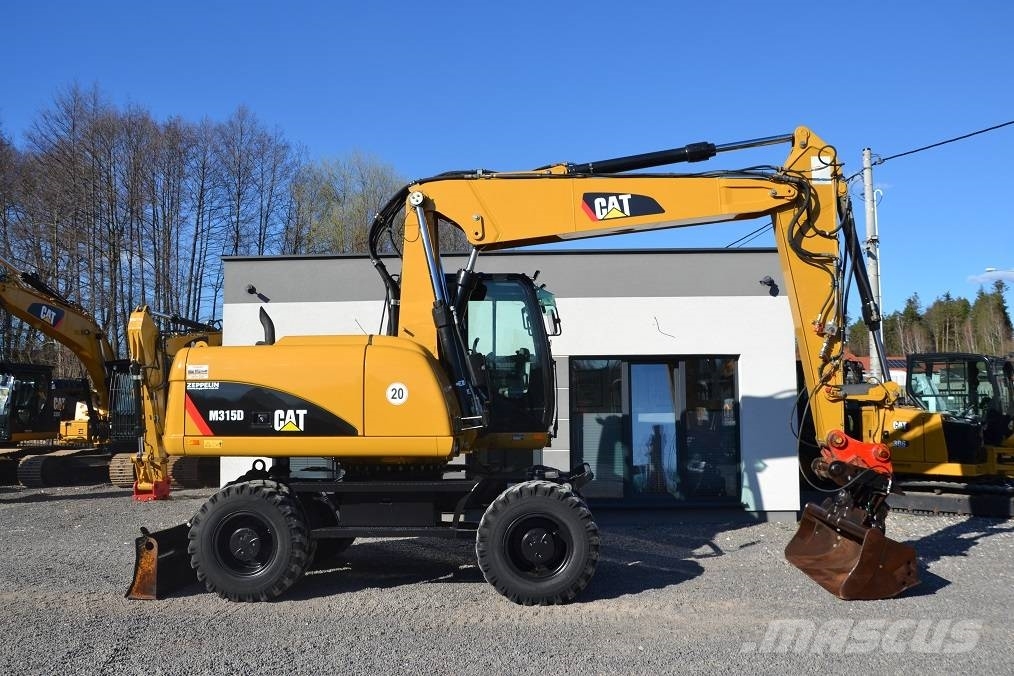 CAT CAT M 315 D Колісні екскаватори