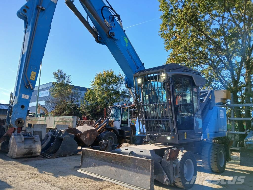 Fuchs MHL 320F Gumikerekes kotrók