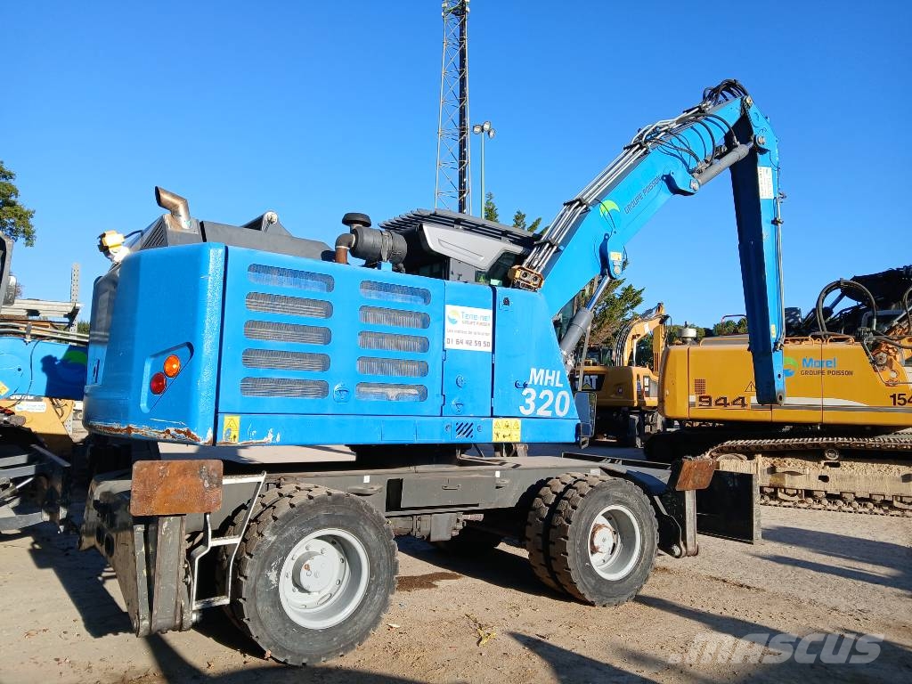 Fuchs MHL 320F Gumikerekes kotrók