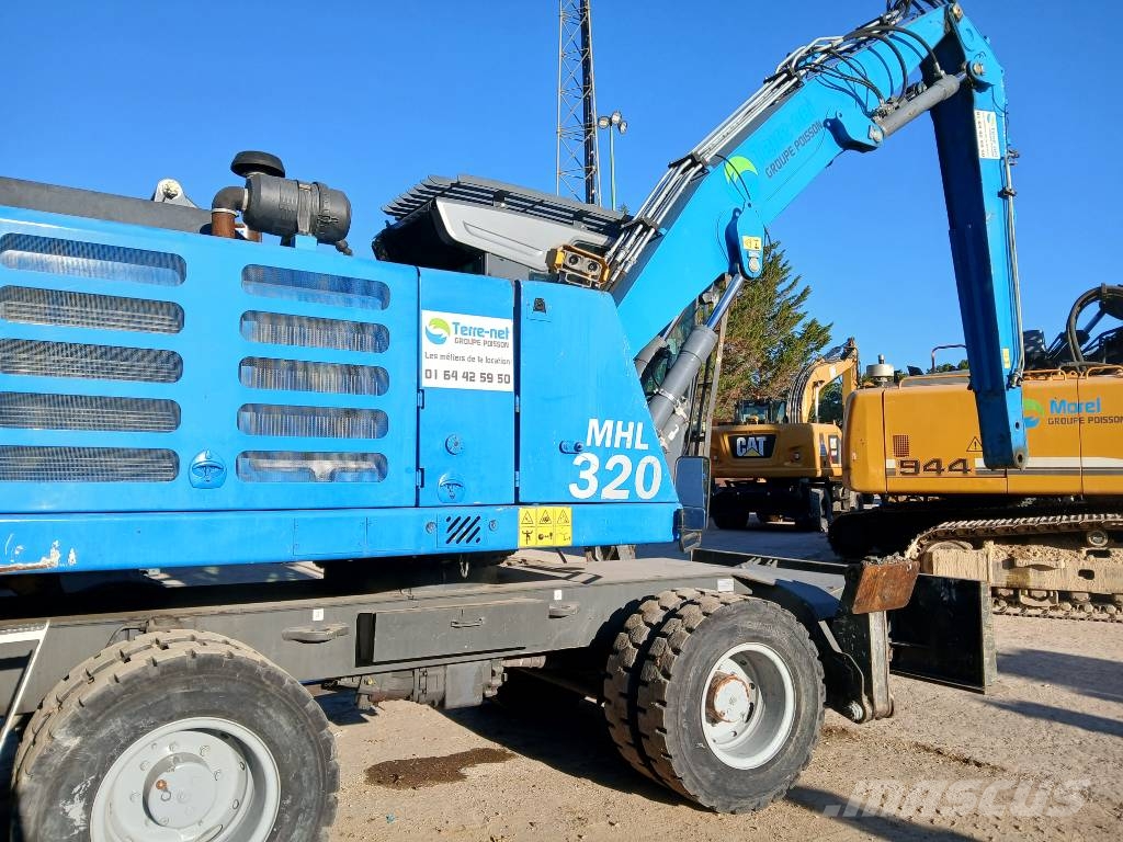 Fuchs MHL 320F Gumikerekes kotrók