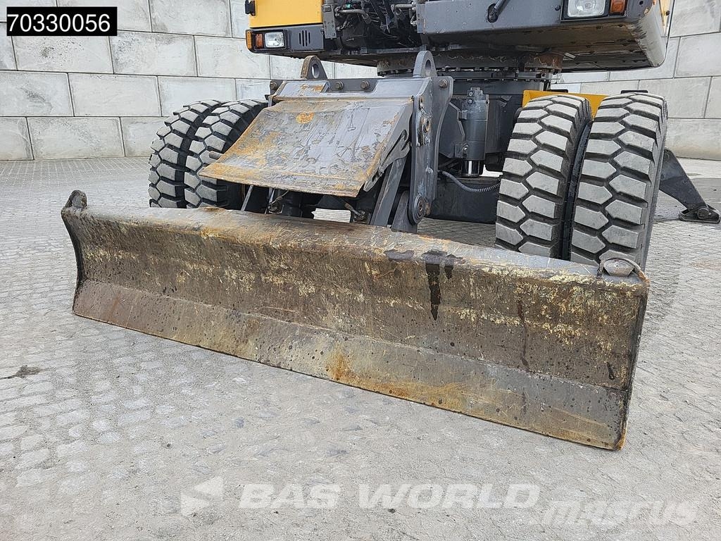 Volvo EW210 D Outrigers + Blade حفارات بعجل