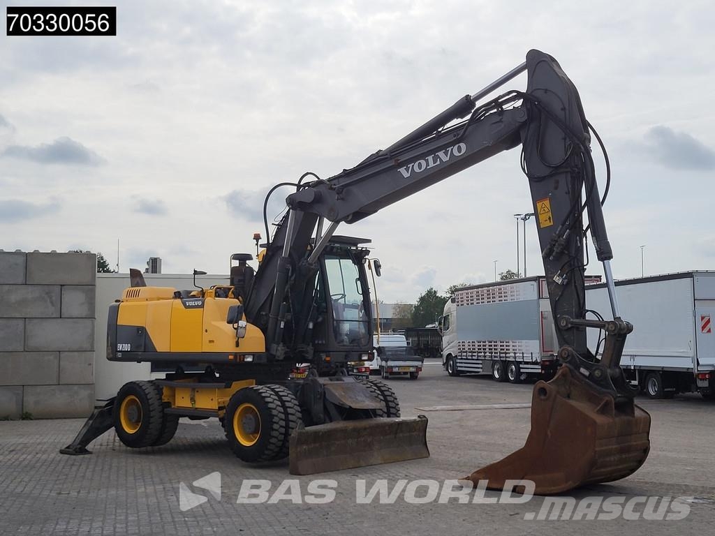 Volvo EW210 D Outrigers + Blade حفارات بعجل