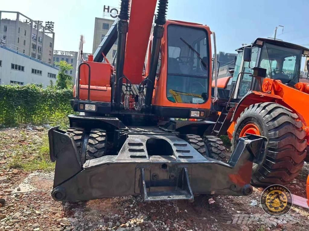 Doosan DH 210 W-7 حفارات بعجل