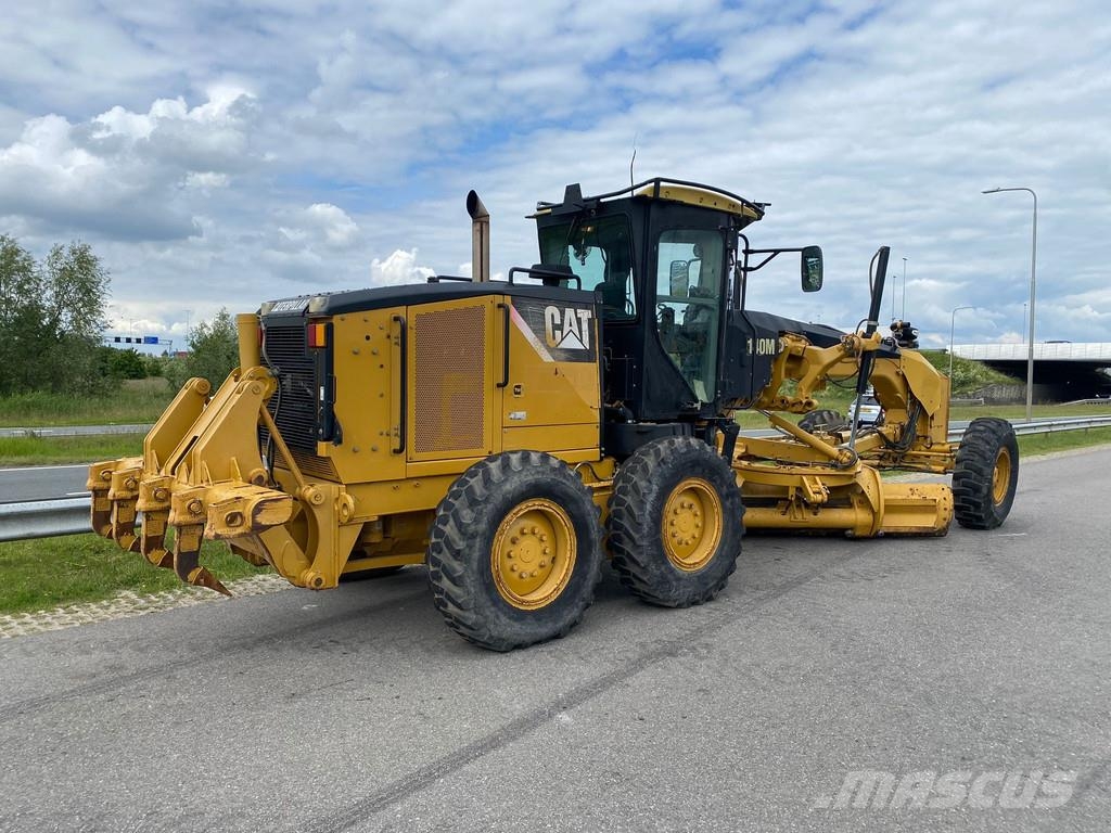 CAT 140M Ripper + Pushblock Tiehöylät