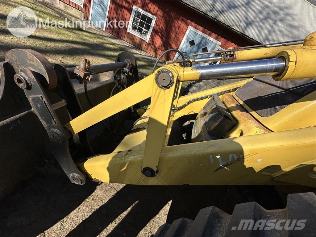 New Holland LB 115 Екскаватори-навантажувачі