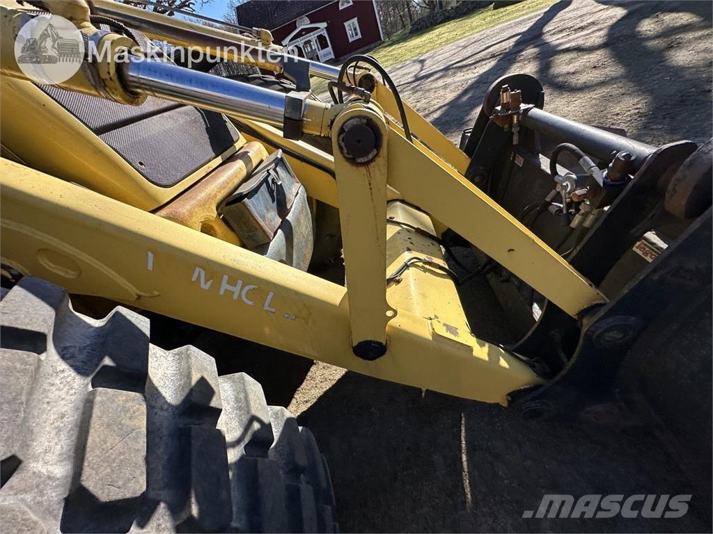 New Holland LB 115 Екскаватори-навантажувачі