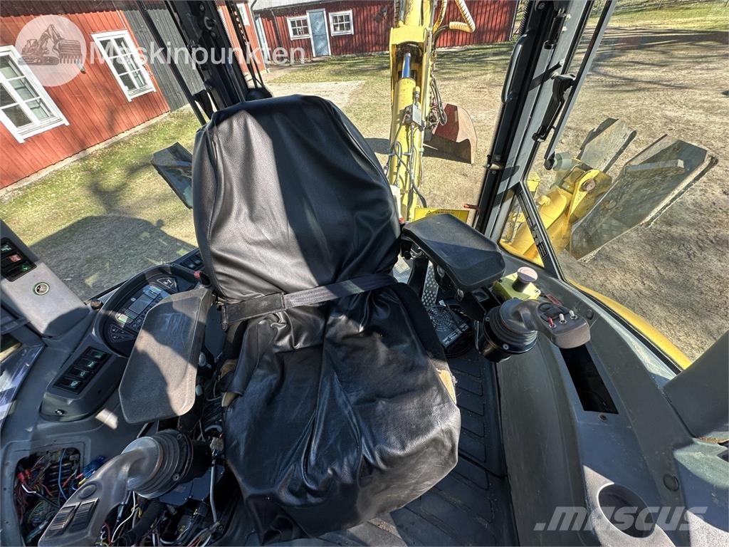 New Holland LB 115 Екскаватори-навантажувачі