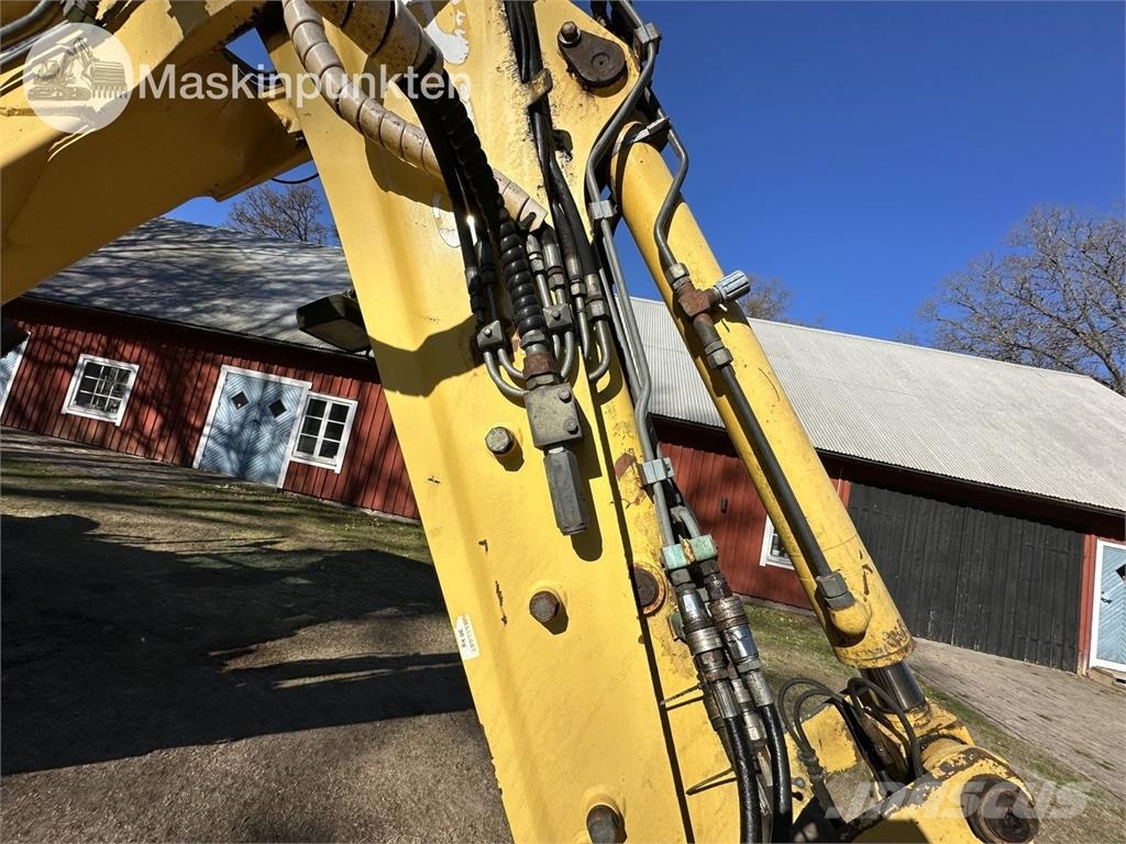 New Holland LB 115 Екскаватори-навантажувачі