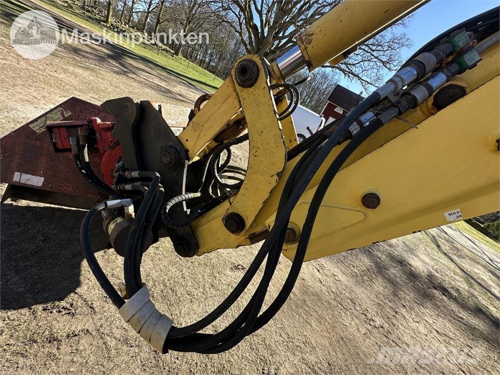 New Holland LB 115 Екскаватори-навантажувачі