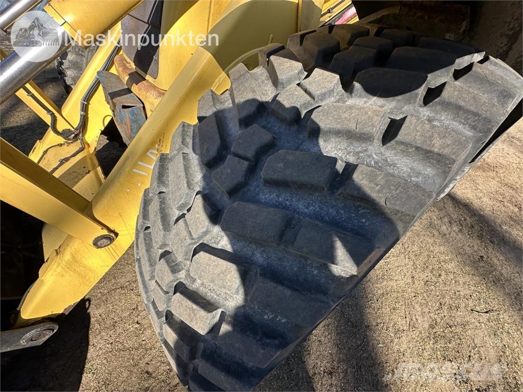New Holland LB 115 Екскаватори-навантажувачі