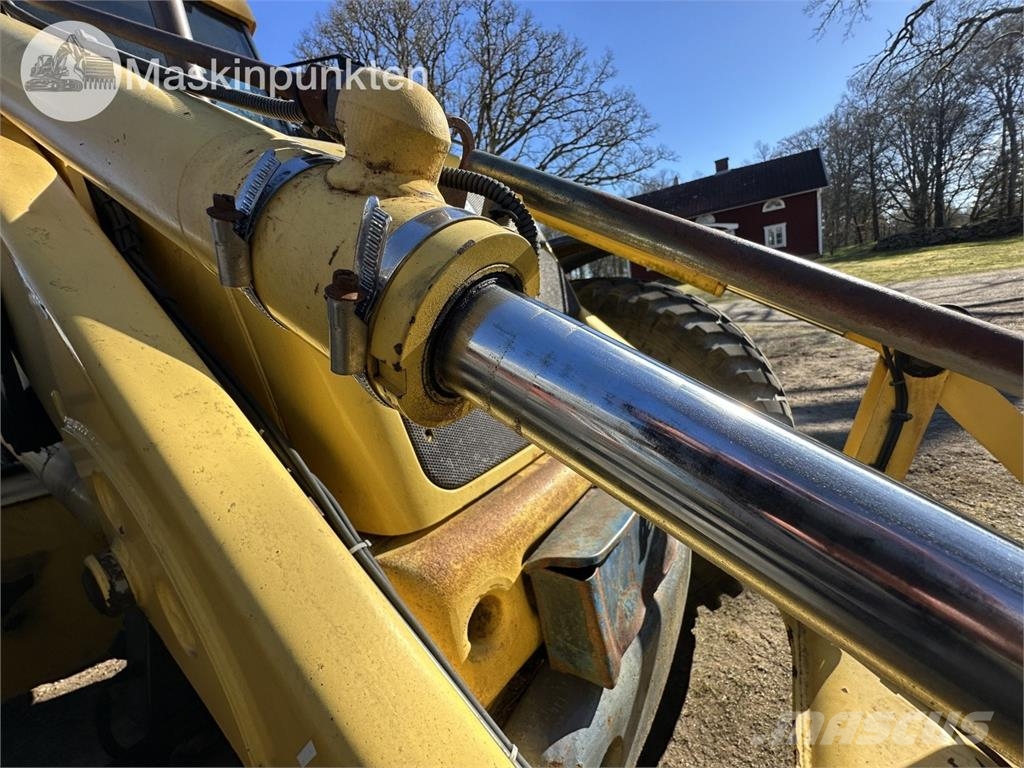 New Holland LB 115 Екскаватори-навантажувачі