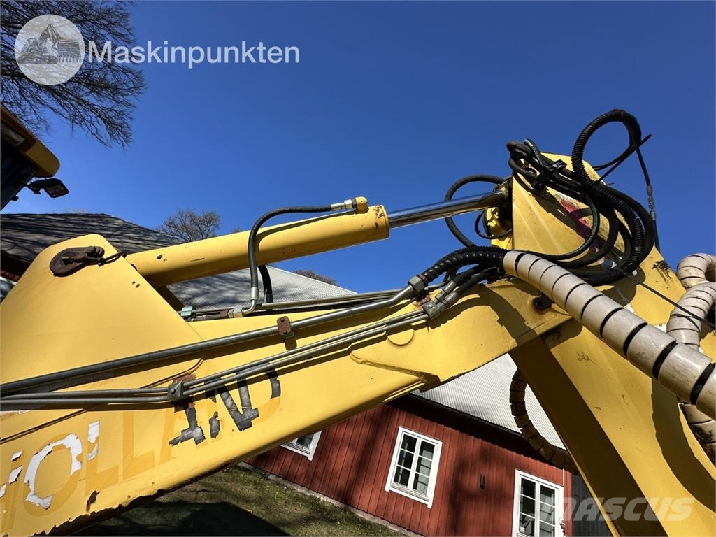 New Holland LB 115 Екскаватори-навантажувачі