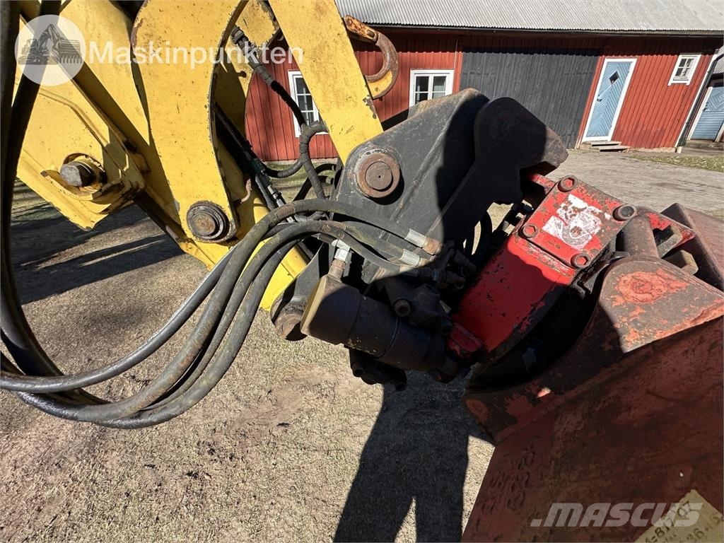 New Holland LB 115 Екскаватори-навантажувачі