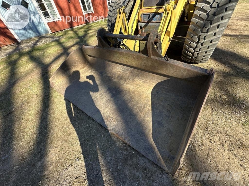 New Holland LB 115 Екскаватори-навантажувачі