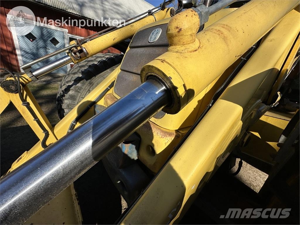 New Holland LB 115 Екскаватори-навантажувачі
