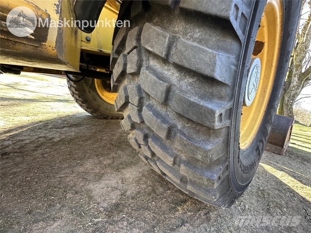 New Holland LB 115 Екскаватори-навантажувачі