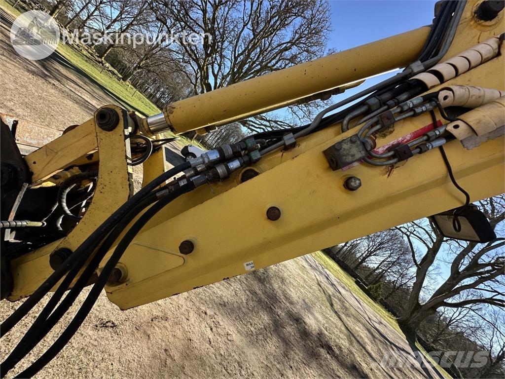 New Holland LB 115 Екскаватори-навантажувачі