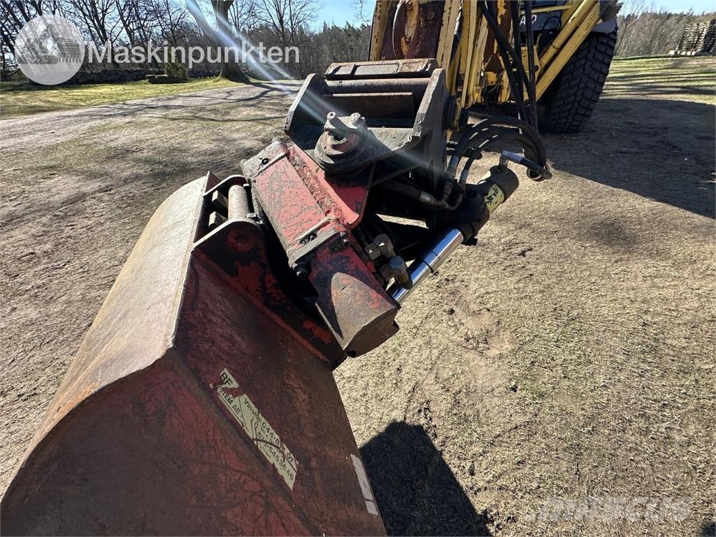 New Holland LB 115 Екскаватори-навантажувачі