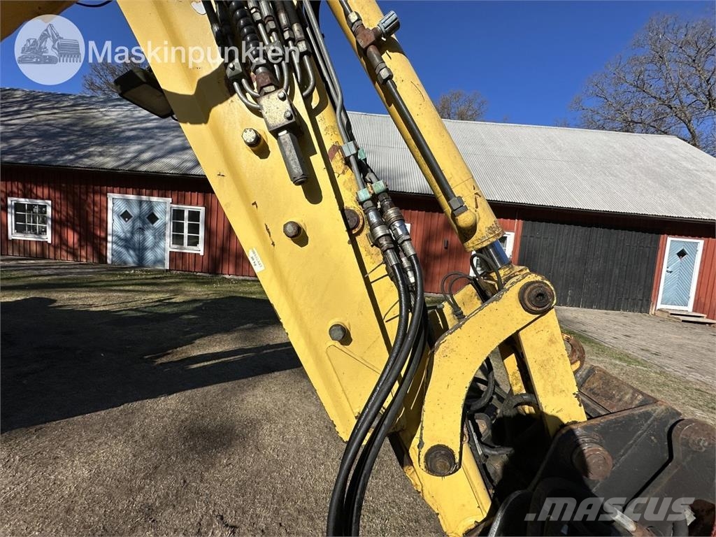 New Holland LB 115 Екскаватори-навантажувачі