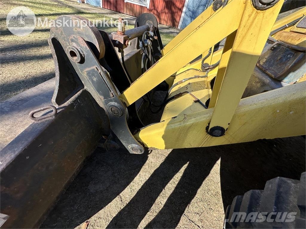 New Holland LB 115 Екскаватори-навантажувачі