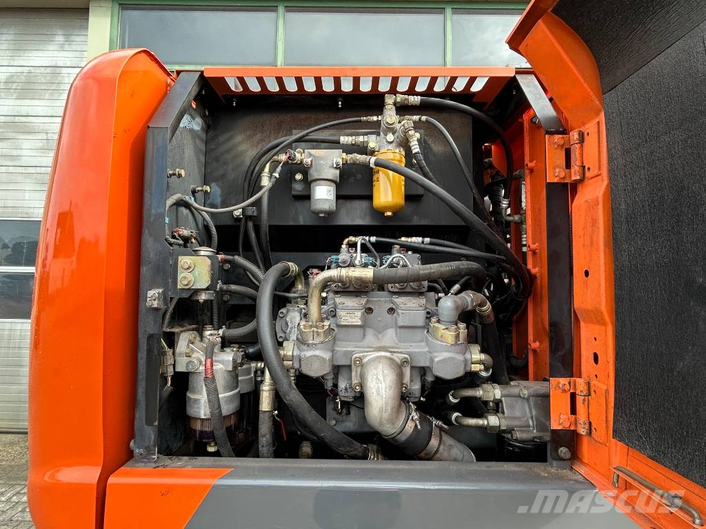 Hitachi ZX 140 W-3 حفارات بعجل