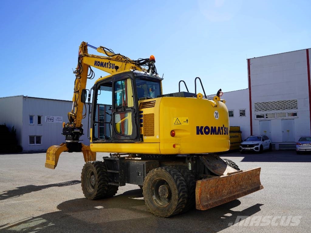 Komatsu PW148 Bagger mieten OQ 65 inkl. Humuslöffel Excavadoras de ruedas