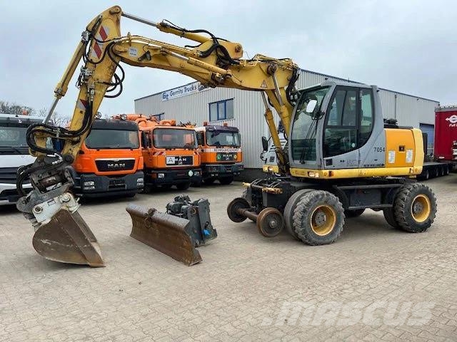 New Holland MH Plus 2wege Bagger Gravemaskiner på hjul