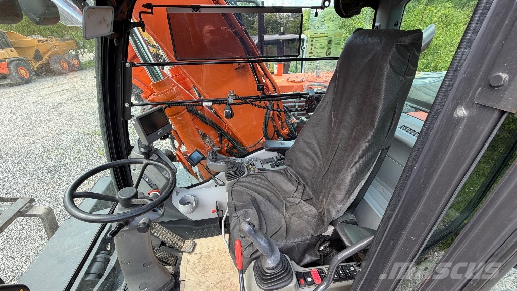 Hitachi Sumitomo ZX 140W-5B حفارات بعجل
