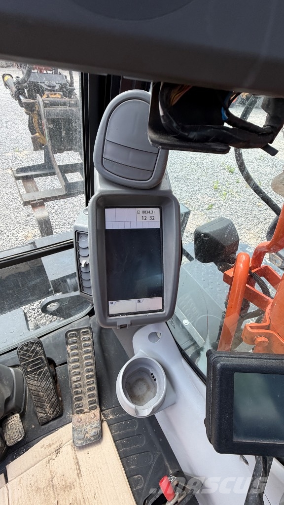 Hitachi Sumitomo ZX 140W-5B حفارات بعجل