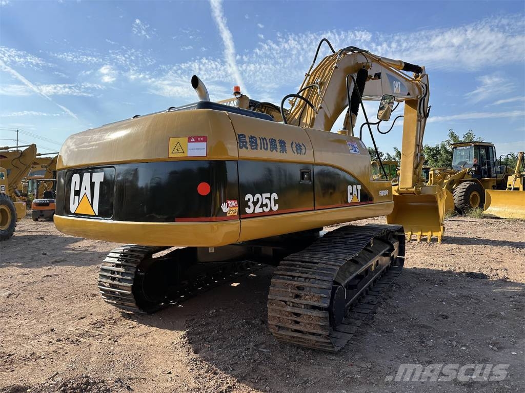 CAT 325 Гусеничні екскаватори