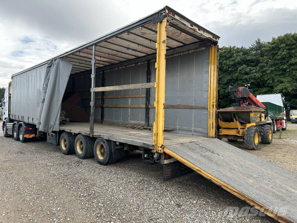 Schmitz Machine transport trailer with big ramp Autotransporter