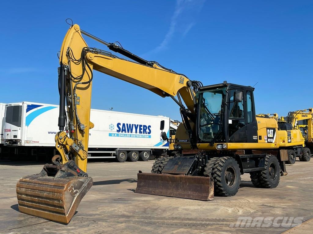 CAT M313D VA - Outriggers + Blade Excavadoras de ruedas