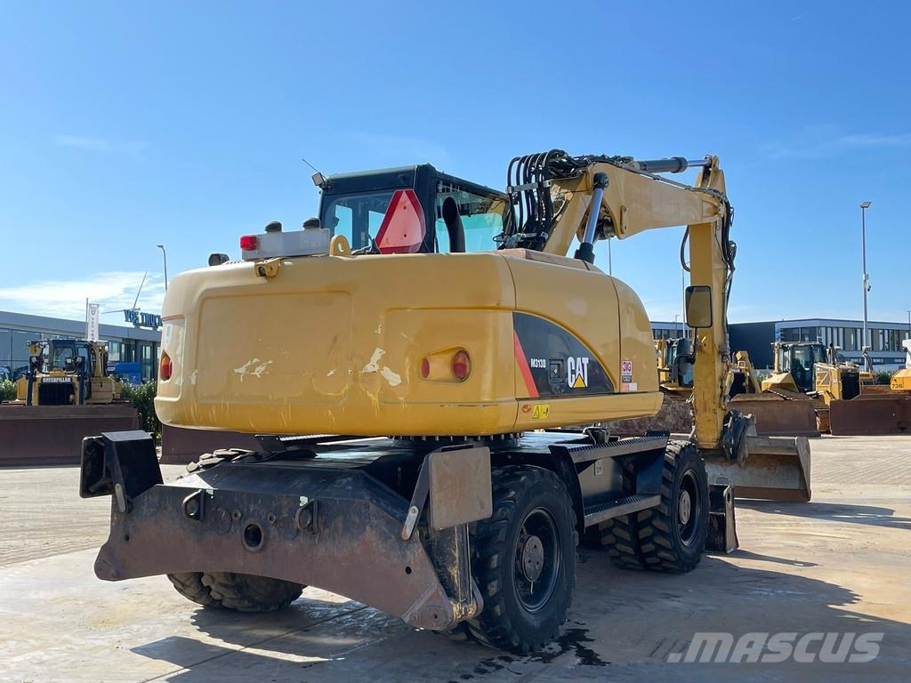 CAT M313D VA - Outriggers + Blade Excavadoras de ruedas