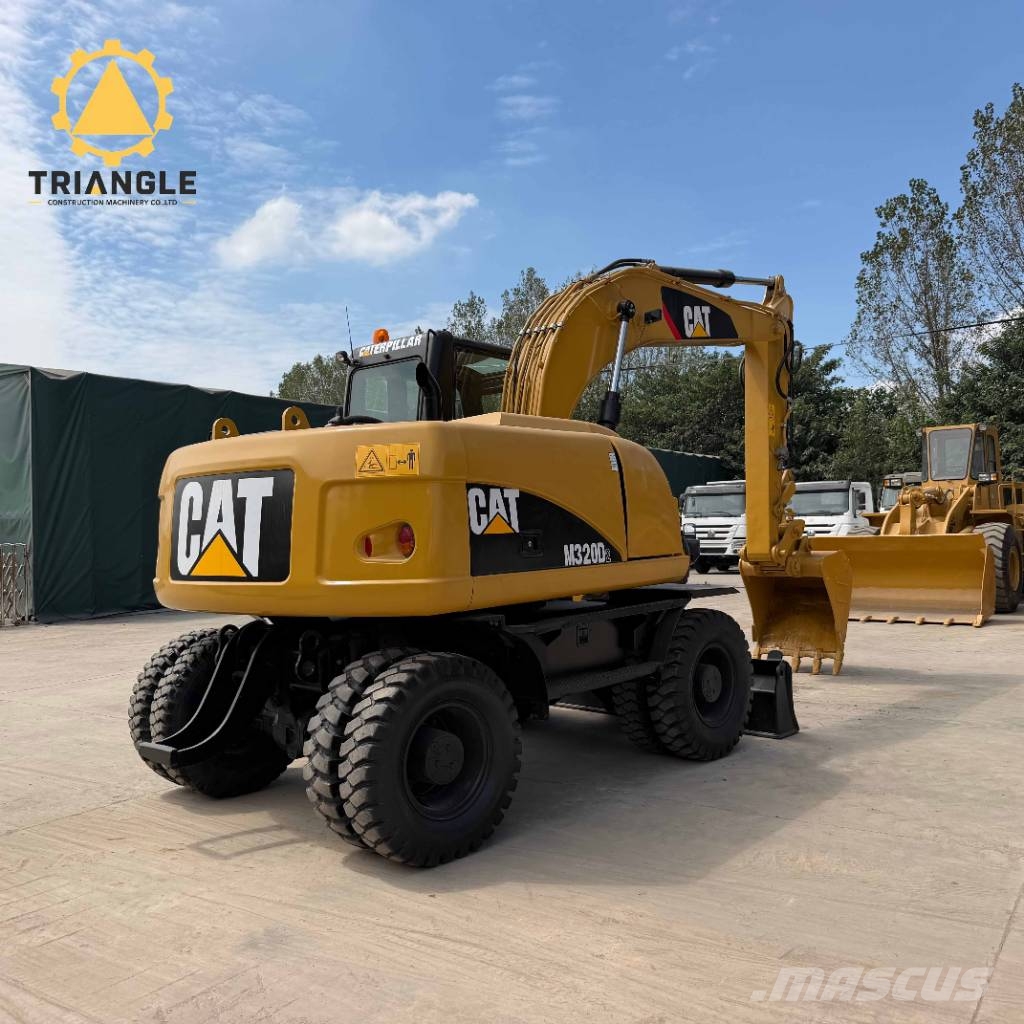 CAT M 320 Bageri na kotačima