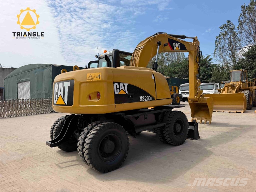 CAT M 320 Bageri na kotačima