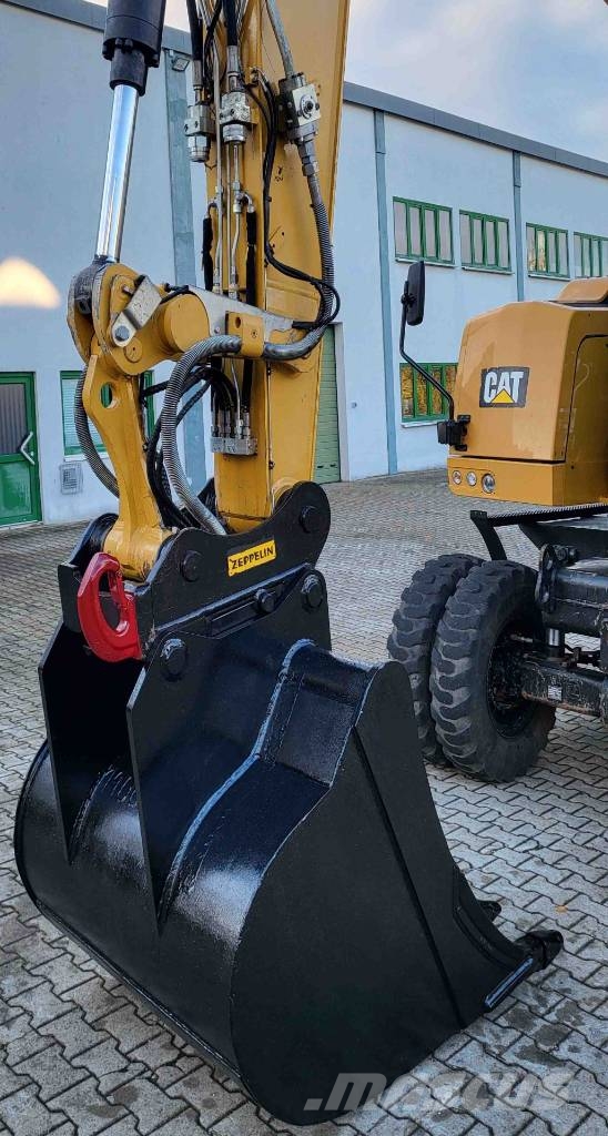 CAT M 318 F حفارات بعجل