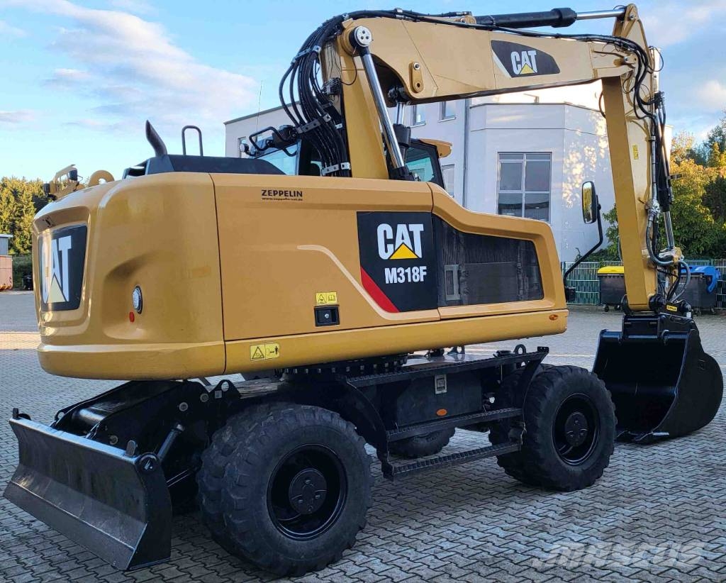 CAT M 318 F حفارات بعجل