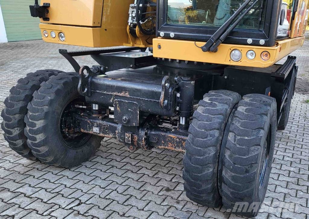 CAT M 318 F حفارات بعجل