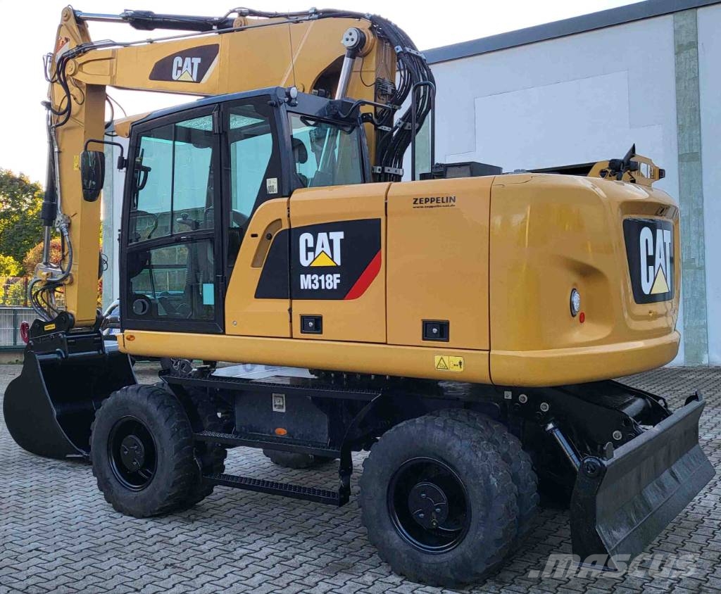 CAT M 318 F حفارات بعجل